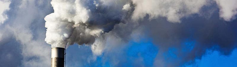 Image of smoke coming out of an industrial chimney